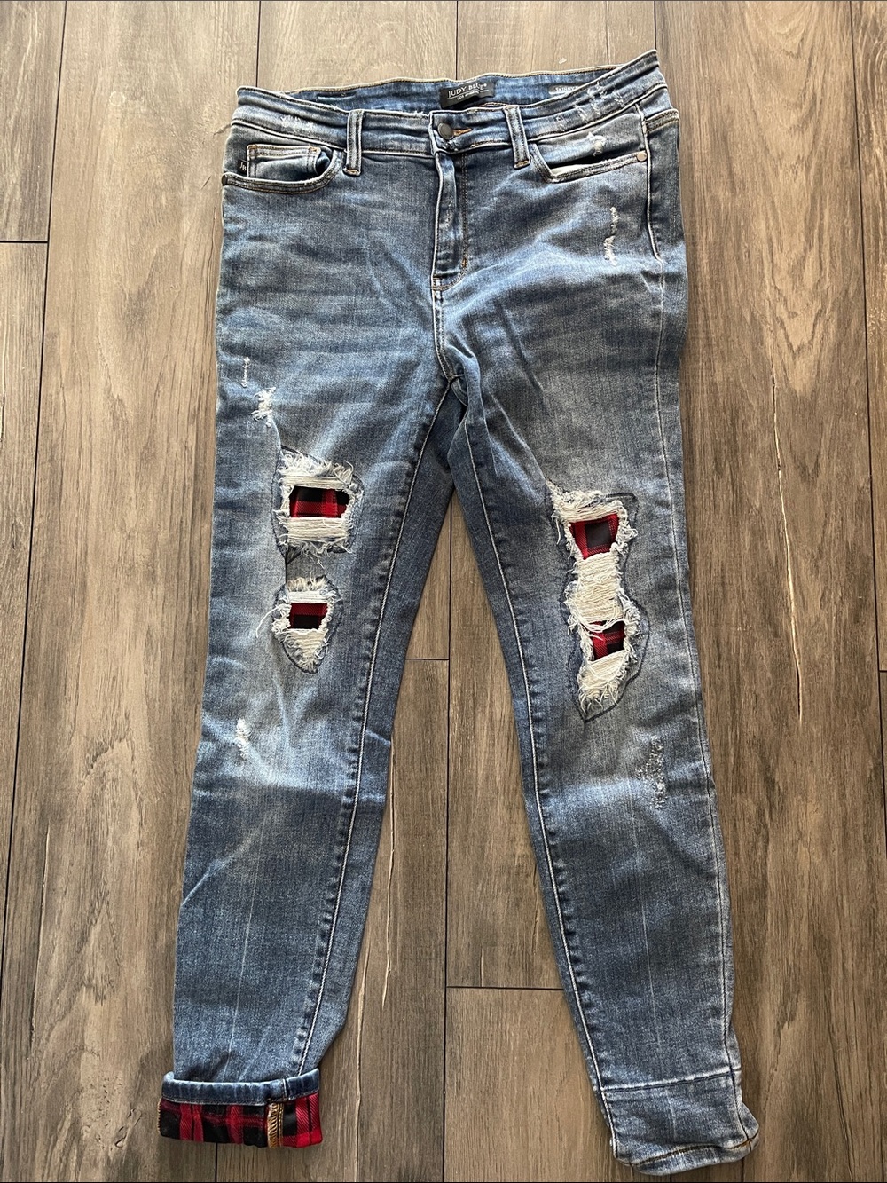 Distressed Blue Women’s Jeans with Red Plaid Backing